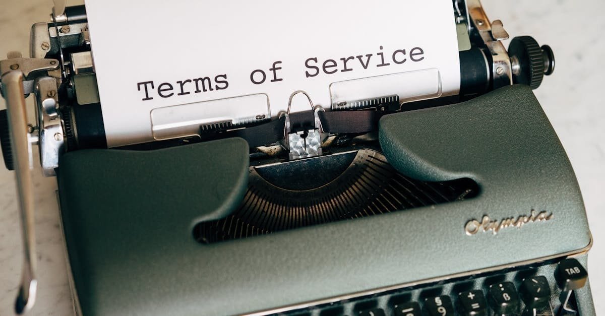 Close-up of a vintage typewriter printing 'Terms of Service' on paper, ideal for legal and business themes. Ethical Founder Terms and Conditions of Service