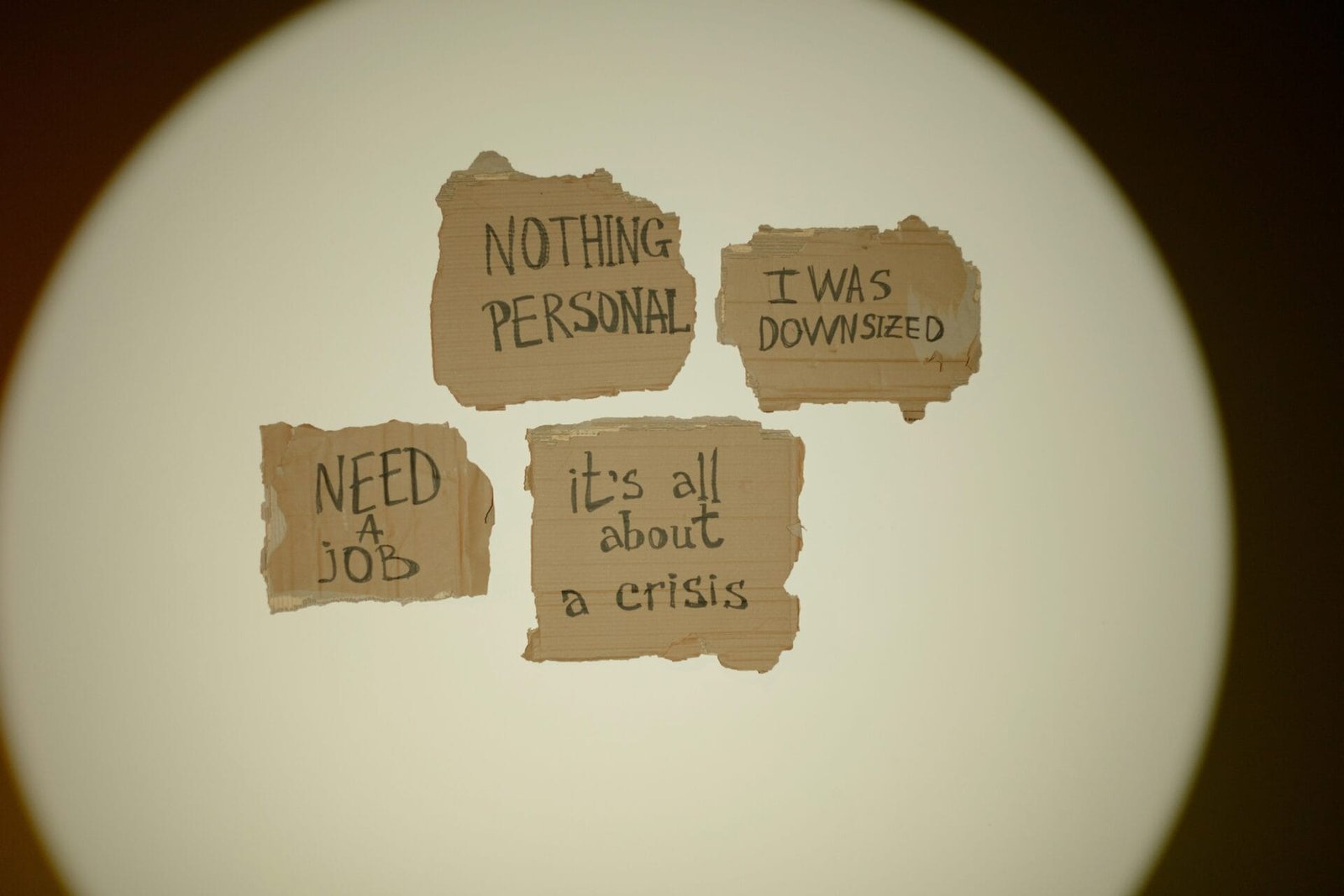 Cardboard signs convey job loss and economic crisis message, ideal for articles on unemployment. Automated Job Application System, Automated Job Application System for MSME, Ethical Founder Automation for Job Search,