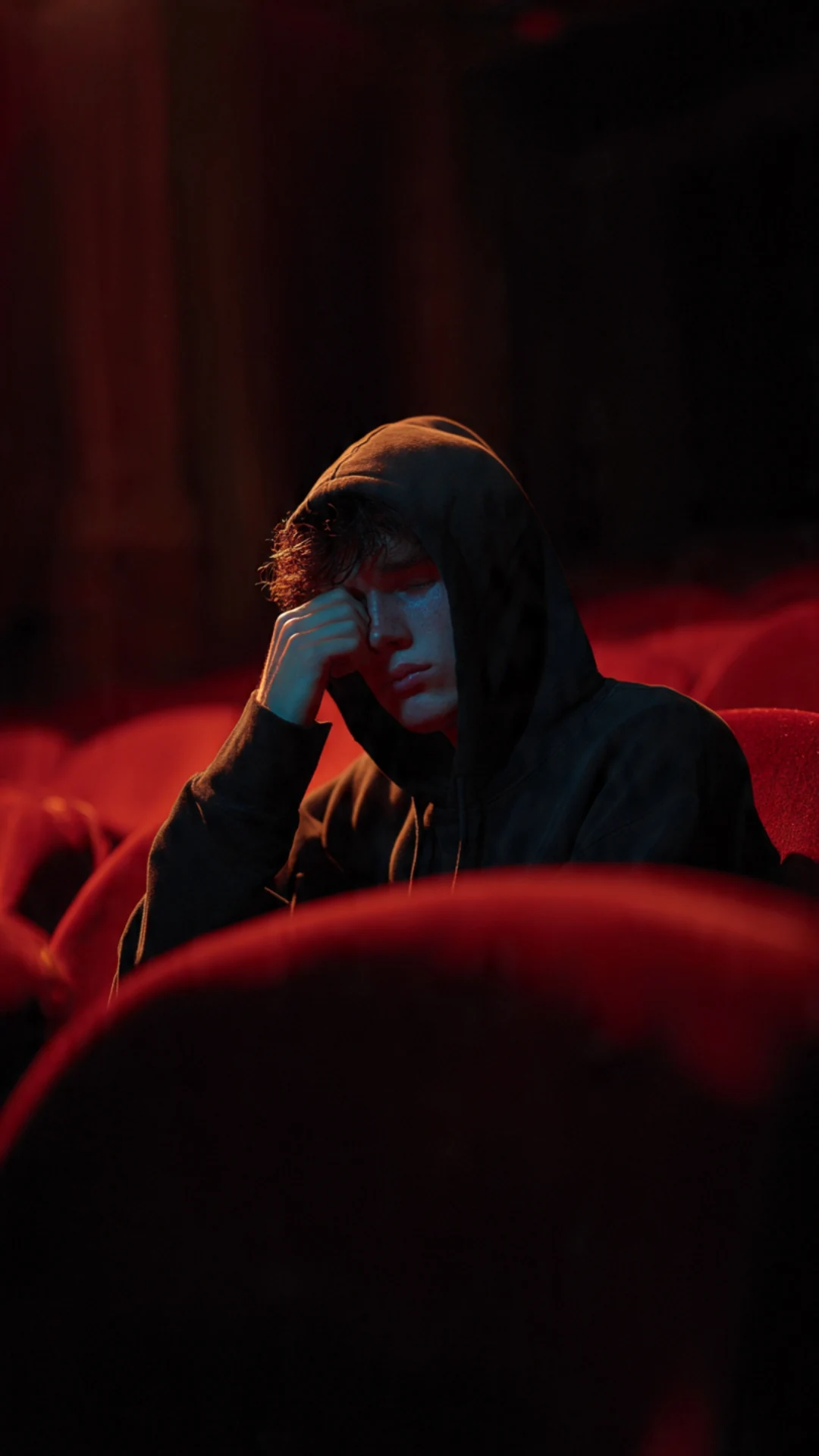 Grok AI image editing prompt empty movie theater heartbreak with dramatic contrast lighting